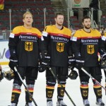 The German players listen to the national anthem after their win vs Japan. Photo Credit: Jelena Levsina/IIHF